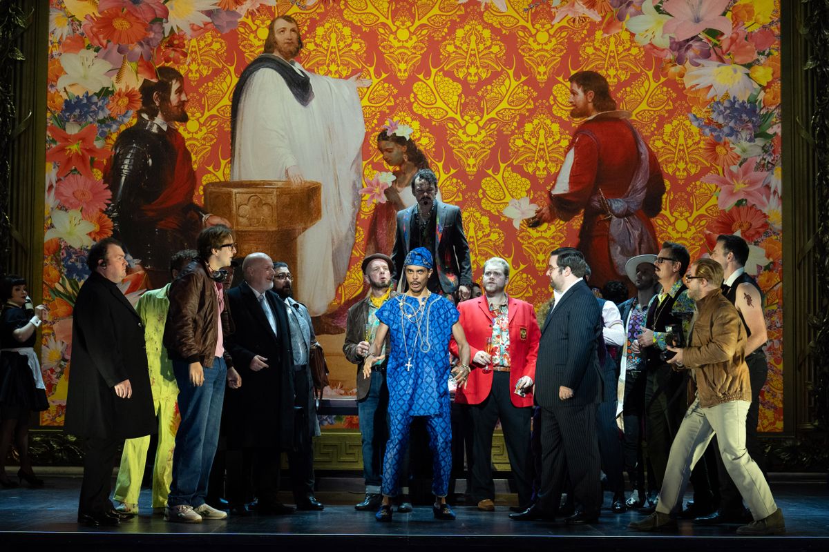 Themba Mvula as Marullo with Ross McInroy as Count Ceprano (behind) and members of the Chorus of Opera North
