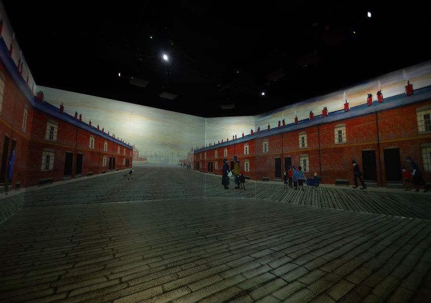 Immersive Lowry 360 gallery installation recreating a red-brick street scene from an LS Lowry painting on all walls.