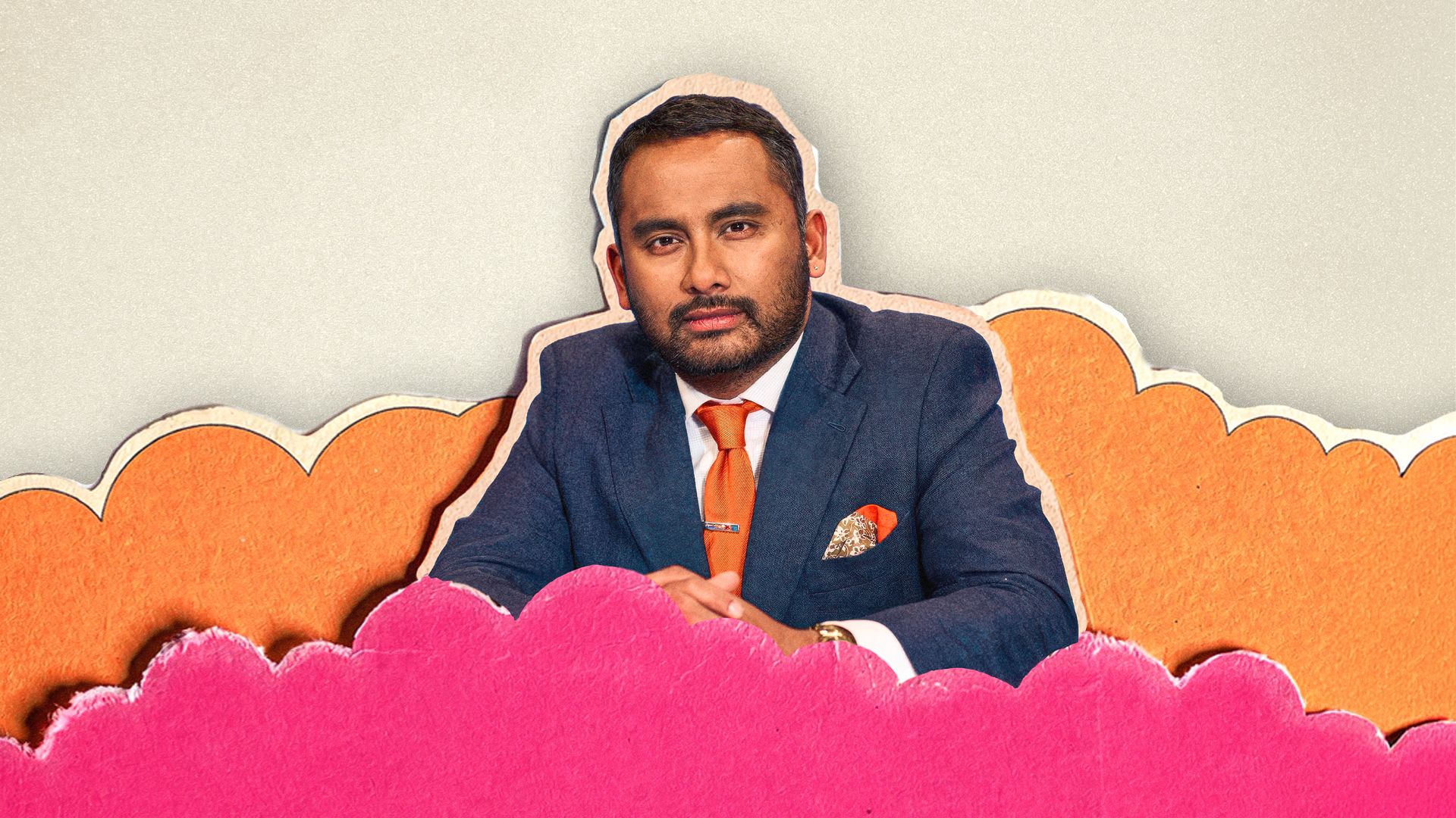 Person in a blue suit with an orange tie seated among layered pink and orange paper-cut clouds against a textured light background.